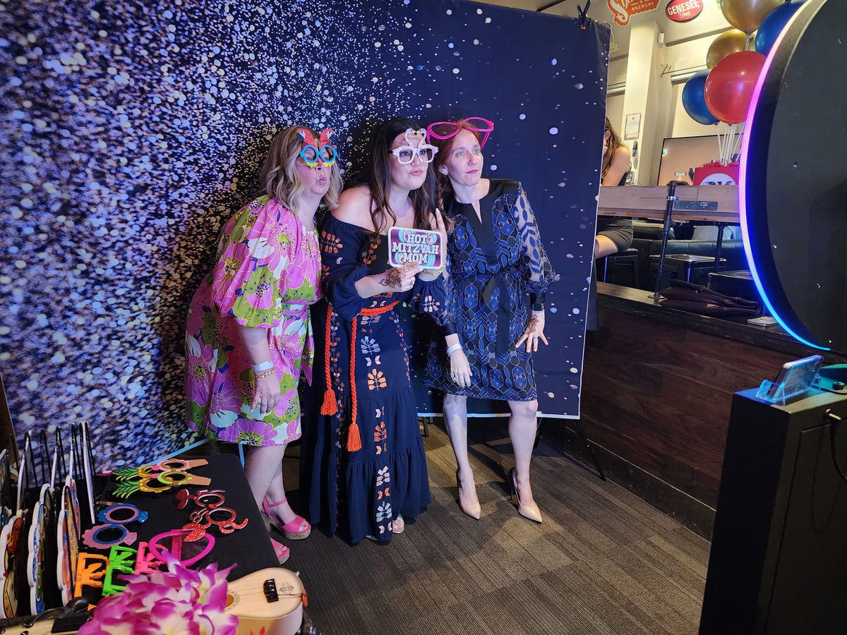 Guests using the LCD Photo Booth at a Bar Mitzvah event