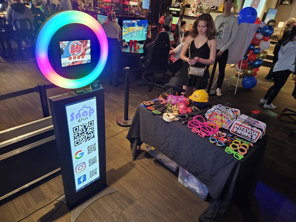 Guests posing with props at the LCD Photo Booth