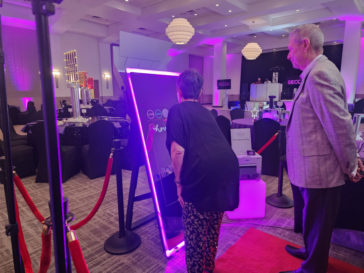 Guest signing their photo on the Mirror Photo Booth screen