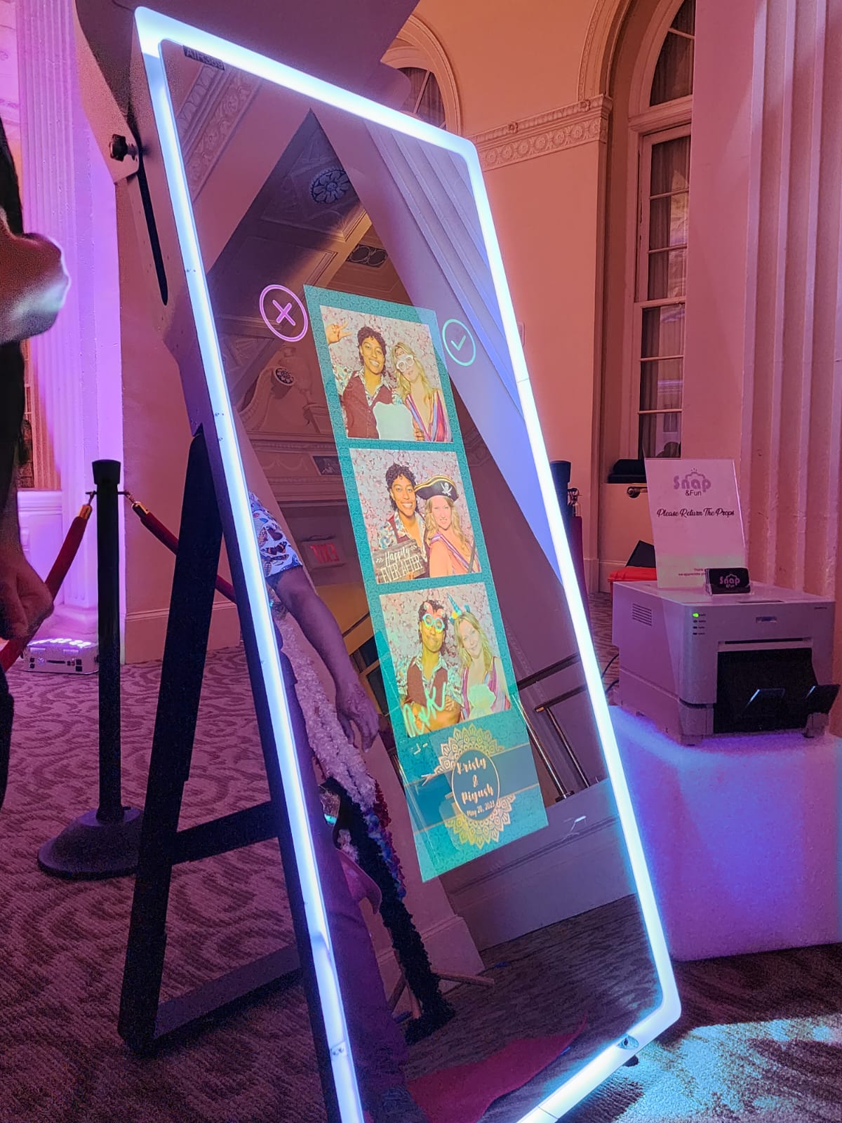 Mirror Photo Booth with instant photo printer producing a print